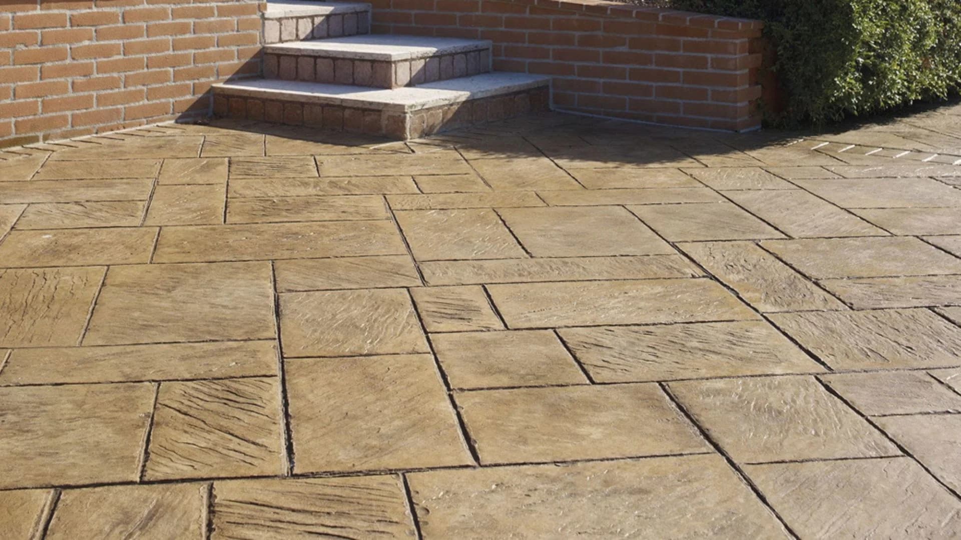 Artisan stamped concrete flooring on an outdoor patio in Saudi Arabia with natural stone pattern by Floroz craftsmen