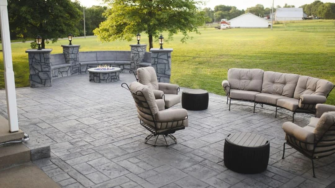 Stamped concrete patio flooring in Saudi Arabia with outdoor seating by Floroz