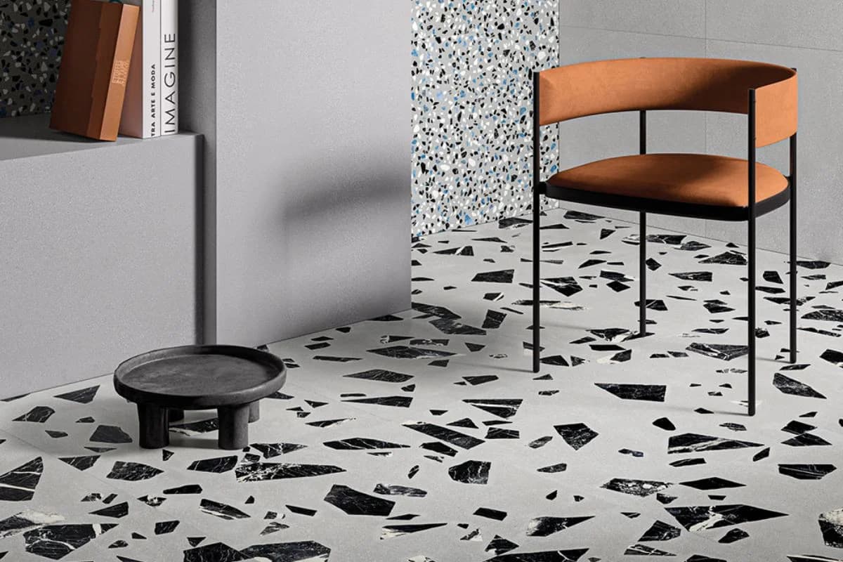 Contemporary living space with black and white terrazzo flooring and modern furniture in Khobar, Saudi Arabia by Floroz