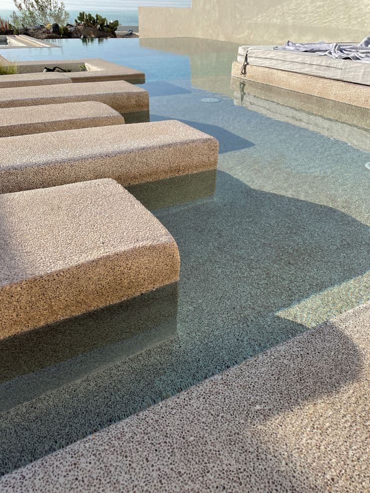 Buff quartz resin-bound garden path with natural stone edging