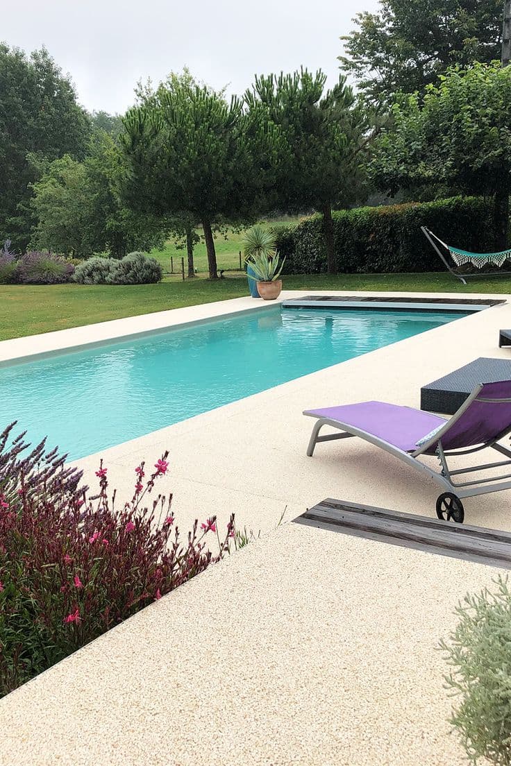 White quartz resin-bound pool surround with DCOF 0.45+ wet slip rating