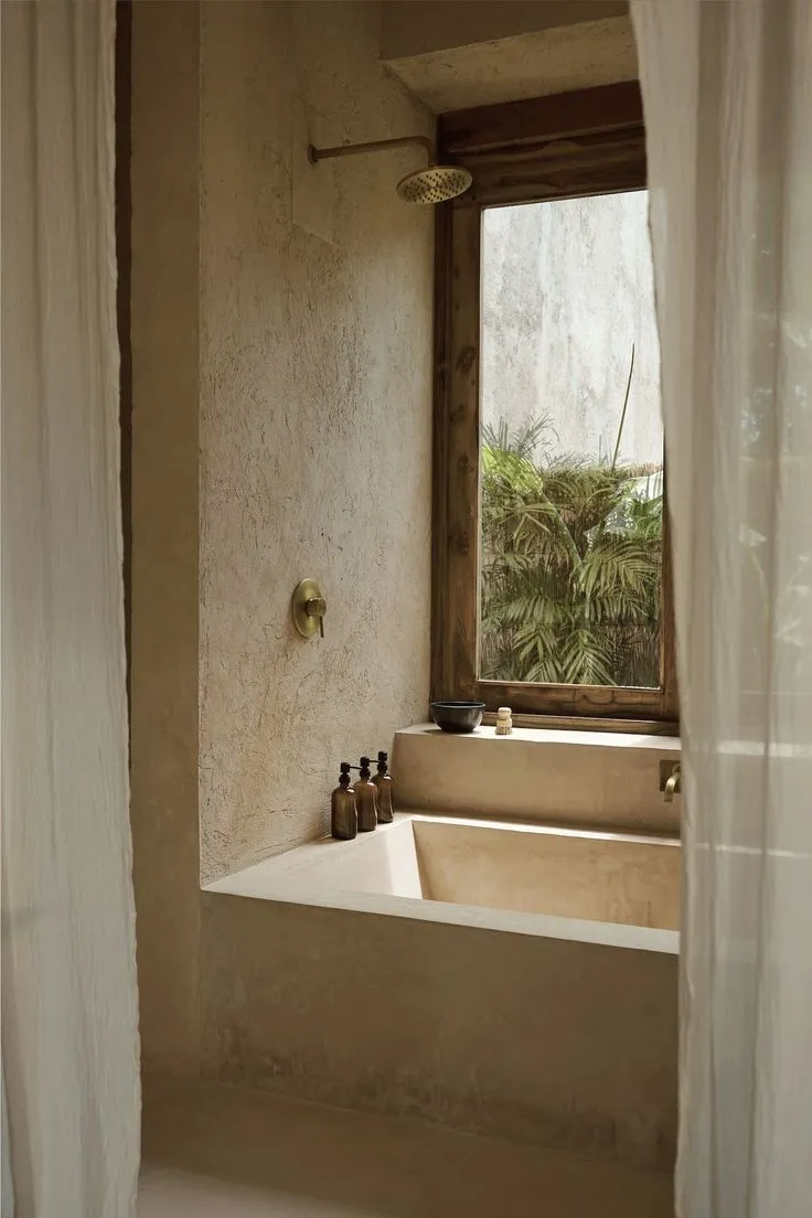 Slate Grey microcement shower walls with a moody, dark charcoal mineral texture for a modern industrial wet room.