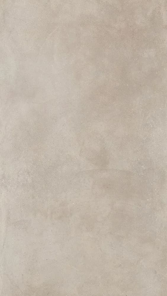 Seamless feathered silk microcement wall finish in a soft beige tone, providing a minimalist and smooth mineral surface.