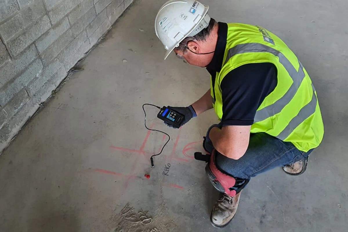 Floroz engineer performing concrete floor moisture testing before epoxy flooring installation in Saudi Arabia