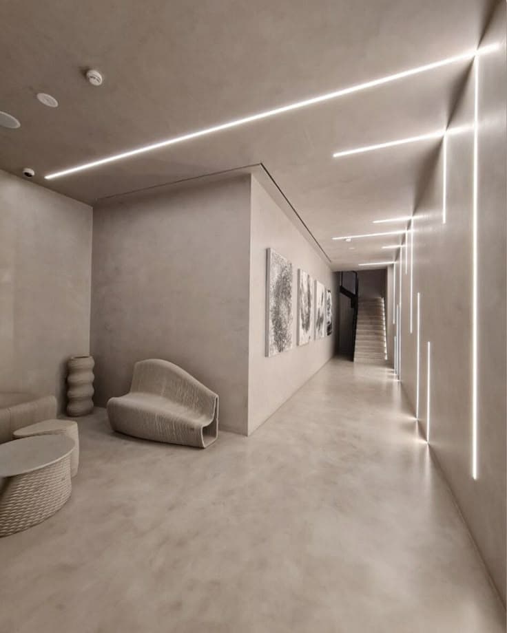 Contemporary minimalist hallway in Riyadh with microcement flooring, beige and gray tones, heat-resistant luxury design for 50°C summers