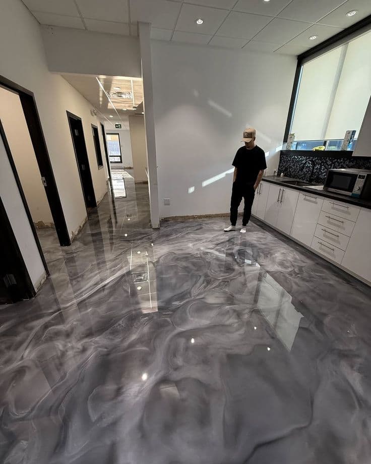 Silver liquid metallic epoxy floor coating for a modern kitchen in Saudi Arabia.