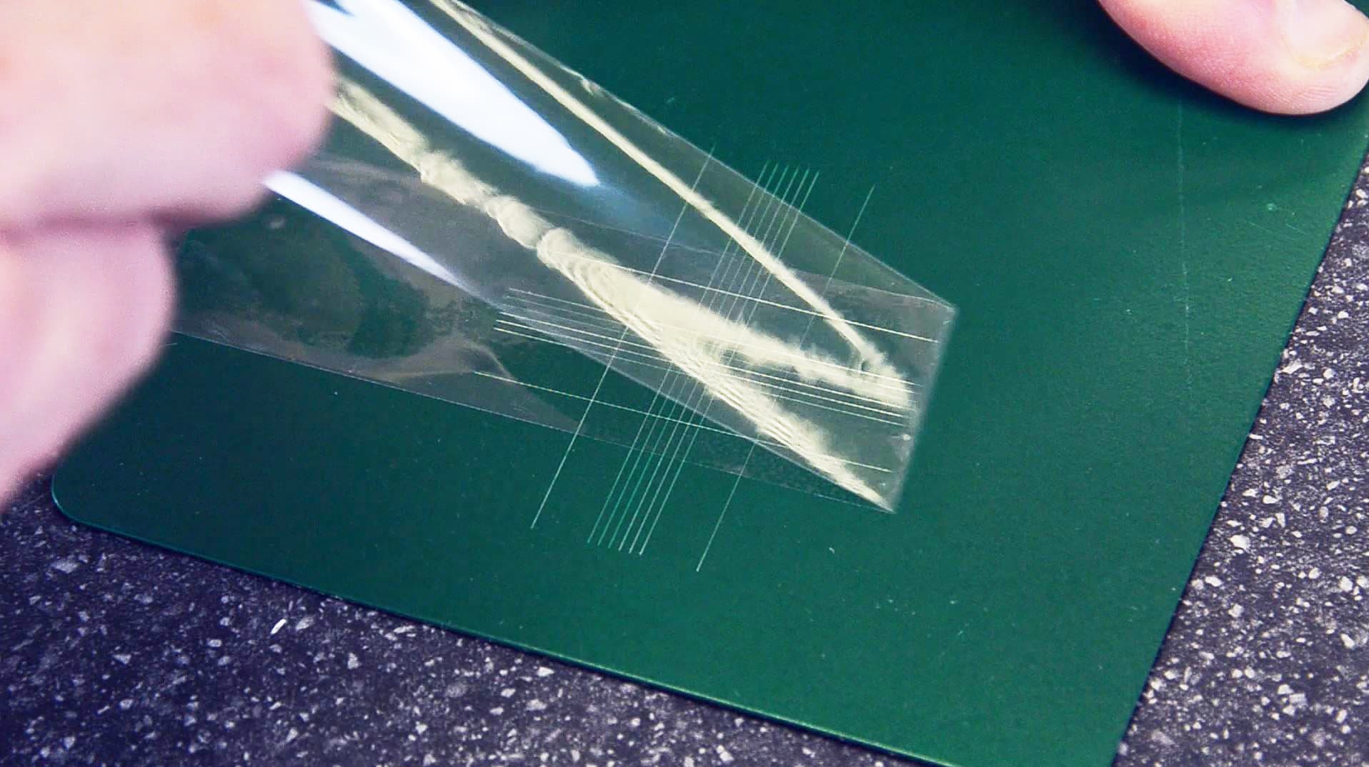 ASTM D3359 cross-hatch adhesion test on a high-gloss industrial epoxy floor to verify 5A rating and bonding performance