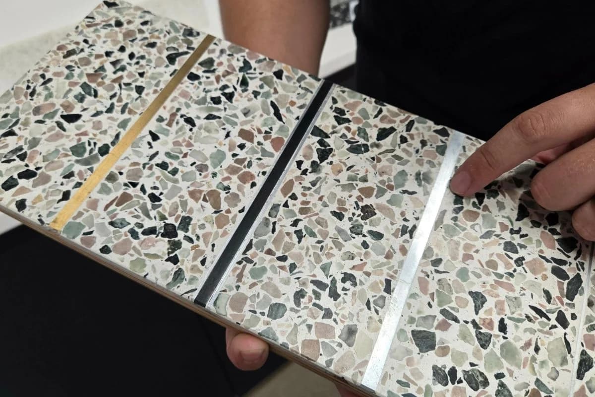 Brass divider strip layout installation for epoxy terrazzo bay geometry and expansion joint alignment