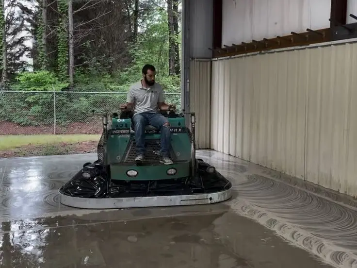 Fine diamond polishing pads working through progressive grits on a densified concrete surface