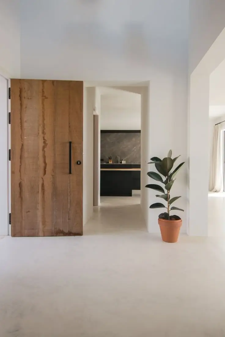 White minimalist epoxy flooring in a Riyadh interior — high-gloss seamless surface with clean aesthetic