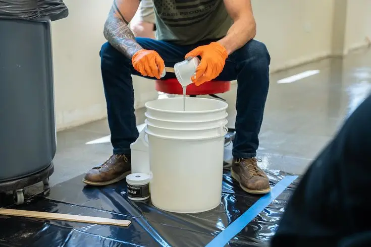 Epoxy resin and hardener being weighed and mixed to the correct stoichiometric ratio