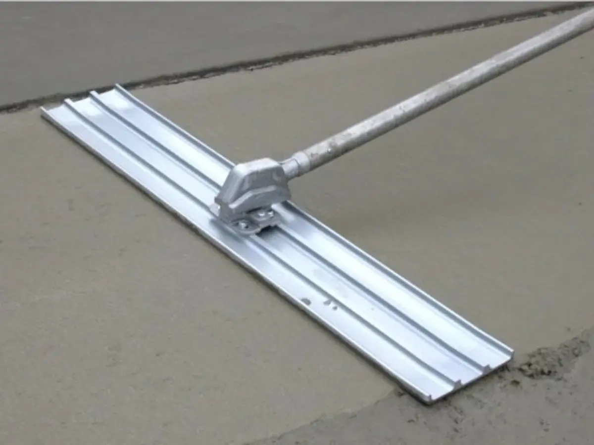 Steel rebar reinforcement grid installation for a vehicle-rated stamped concrete slab