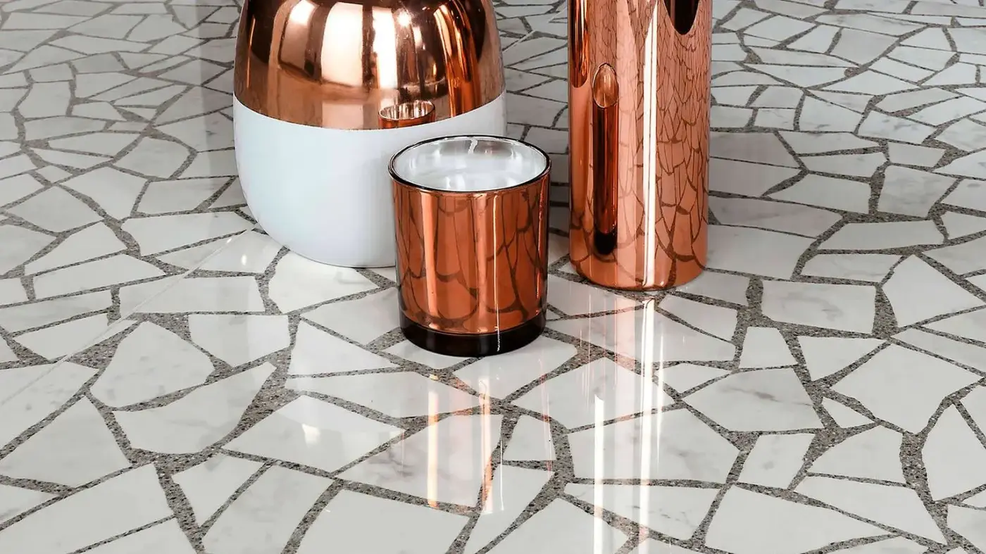 Seamless poured terrazzo with custom marble aggregate blend and brass divider strips positioned to structural joints