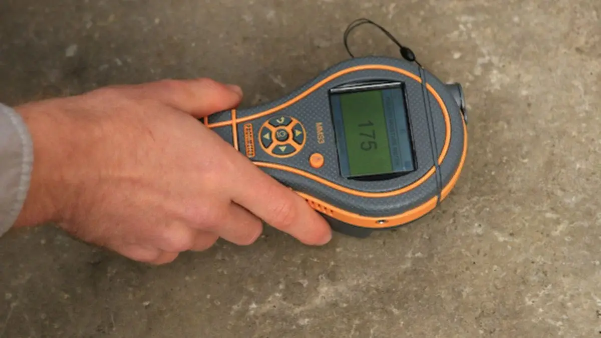 Slab vapor emission test being performed to check moisture levels before microcement installation